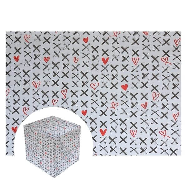 Glossy gift wrapping paper covered with black crosses and scattered red hearts in a repeating pattern.