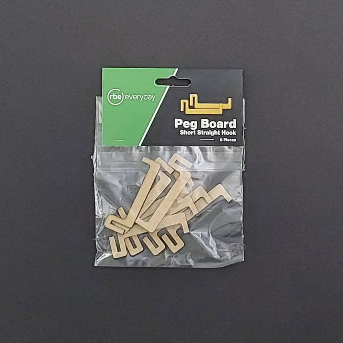 A packaged set of beige RBE peg board short straight hooks is shown, labeled Peg Board Short Straight Hook with six pieces inside the clear bag.